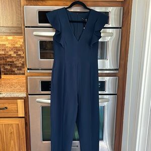 Black Halo navy jumpsuit never worn. Adorable!